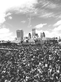 High angle view of crowd in stadium against 30 st mary axe and 20 fenchurch street