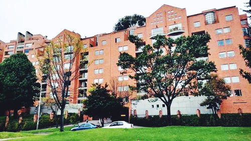 Residential buildings against sky in city