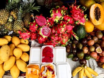 Fruits and vegetables on display at market stall