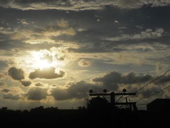 Silhouette trees against sky during sunset