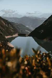 Scenic view of lake and mountains against sky