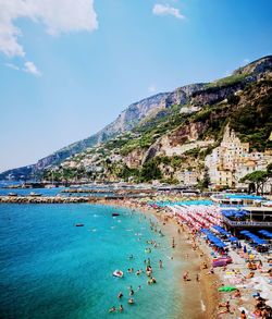 Scenic view of bay against blue sky