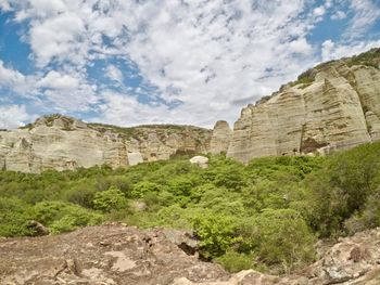 Scenic view of cliff against sky