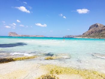 View of beach against blue sky