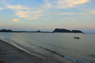 Scenic view of sea against cloudy sky