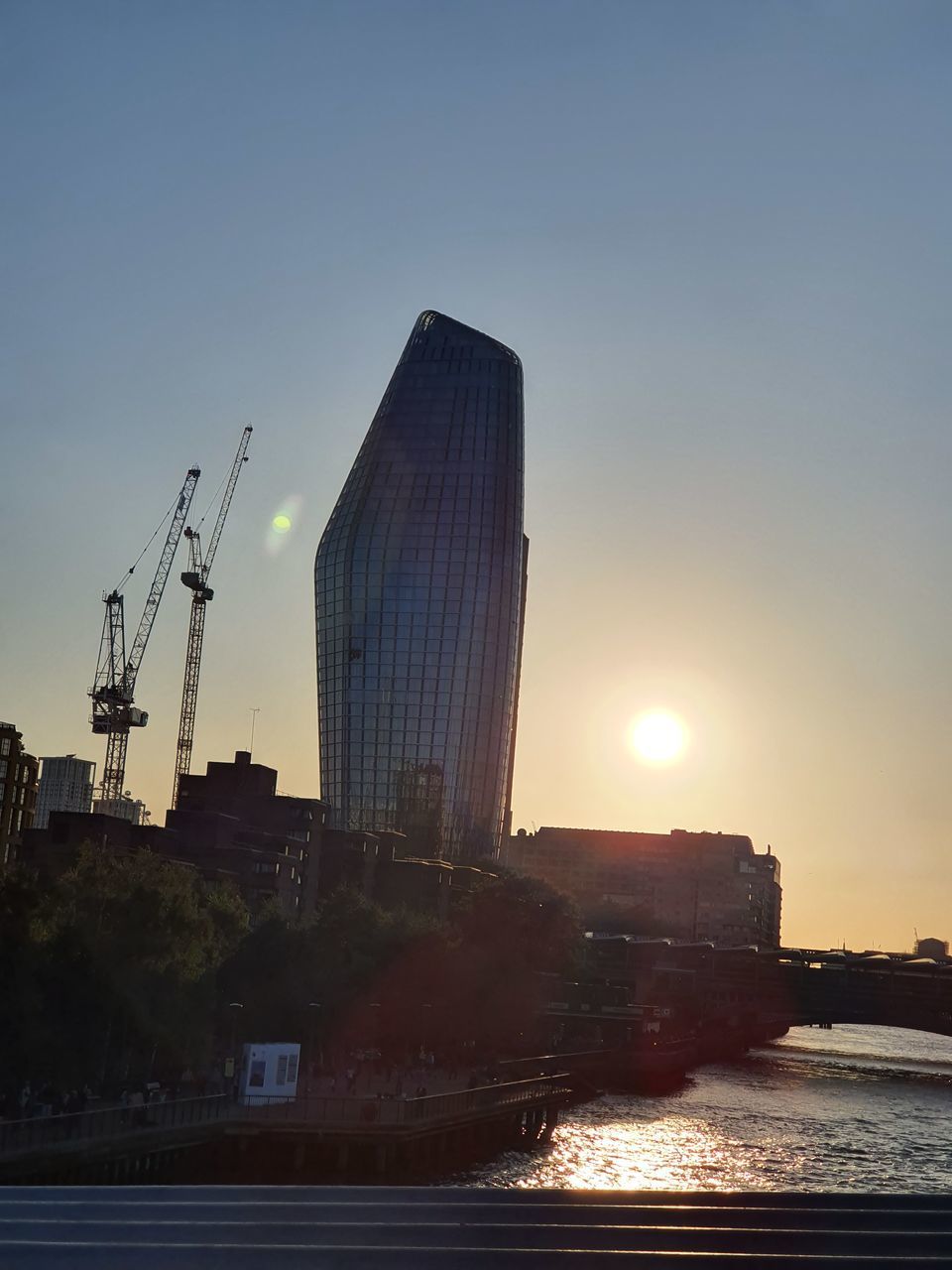 BUILDINGS AGAINST SKY DURING SUNSET