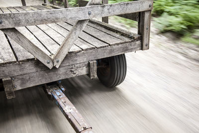 Close-up of wooden post on road