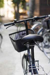 Close-up of bicycle parked on street