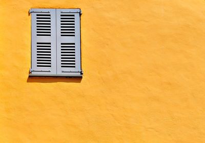 Full frame shot of yellow window on building