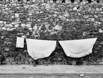 Clothes drying against white wall