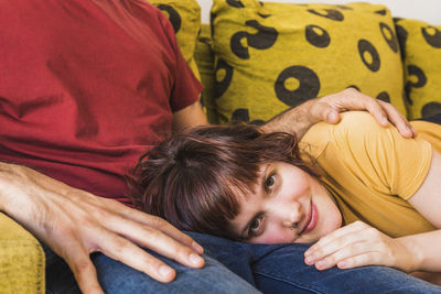 Portrait of friends lying on floor