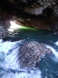 Scenic view of rock formation in sea