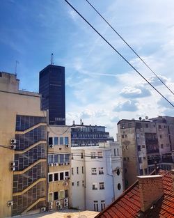 Buildings in city against sky