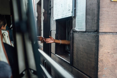 View of bus driver paying road toll