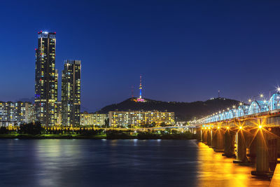 Illuminated buildings at waterfront