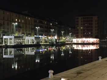 Reflection of illuminated buildings in water at night