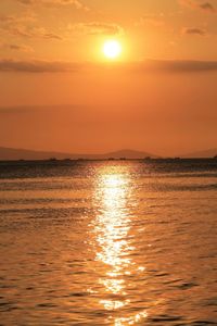 Scenic view of sea against romantic sky at sunset