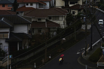 High angle view of street amidst buildings