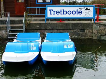 Boats in river with buildings in background
