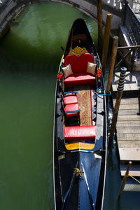 High angle view of red boat moored in canal