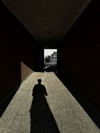 Shadow of man walking in corridor