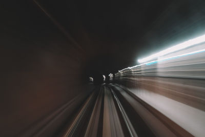 Light trails in illuminated tunnel