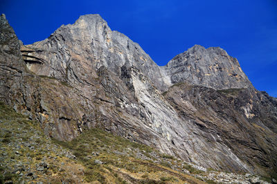 Rocky mountain against blue sky