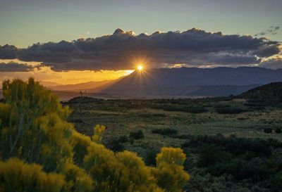 Scenic view of landscape against sky during sunset