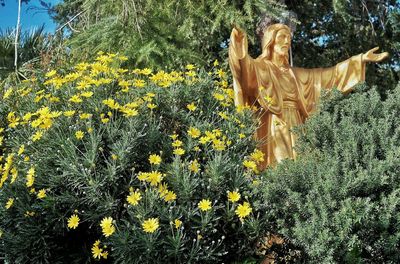 View of yellow statue on field