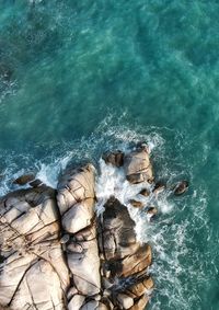 High angle view of rocks in sea