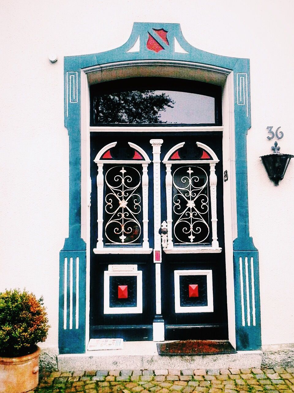 building exterior, architecture, built structure, closed, door, window, entrance, wall - building feature, protection, safety, day, multi colored, low angle view, house, red, facade, wall, outdoors, no people, building