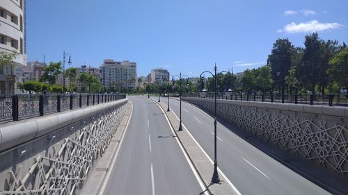 Panoramic view of city street against sky