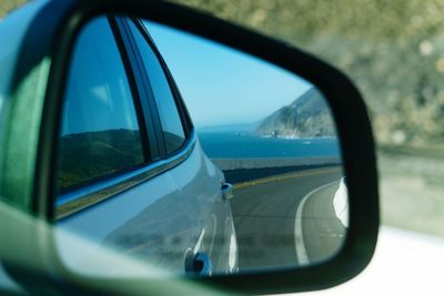 Reflection of car on side-view mirror