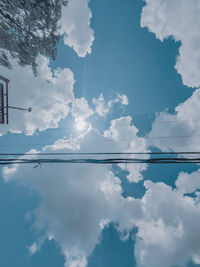 Low angle view of electricity pylon against sky