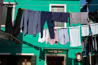 Clothes drying against building in city