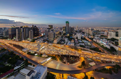 High angle view of city street and buildings against sky