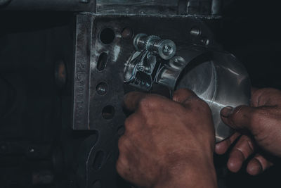 Close-up of man repairing car