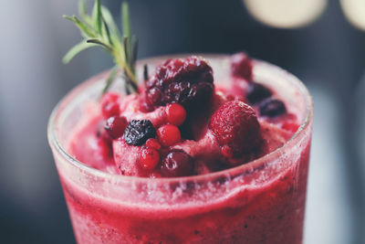Close-up of strawberries in glass on table