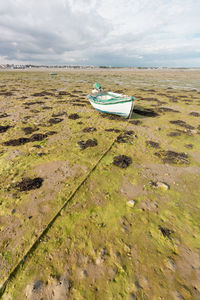 Abandoned boat on the beach of gâvres in brittany in france