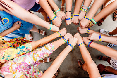 Friends stacking hands