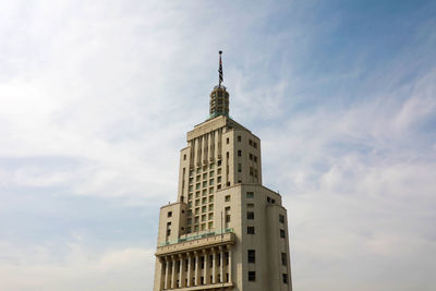 Low angle view of building against cloudy sky