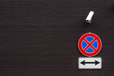 Road sign on wall