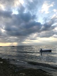 Scenic view of sea against cloudy sky