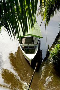 Boat stopped on the river among the trees. nilo pecanha, bahia, brazil.