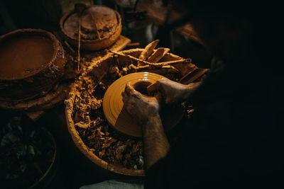 Close up man working with clay