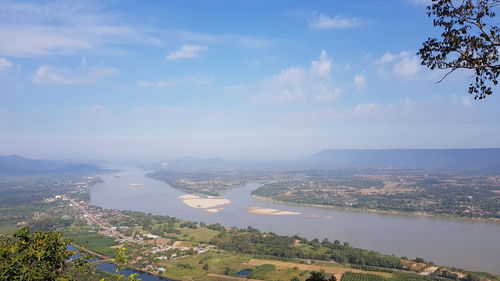High angle view of river and cityscape against sky