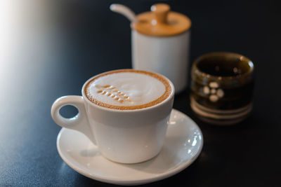 Close-up of coffee cup on table