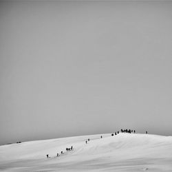 Scenic view of snow covered landscape against clear sky