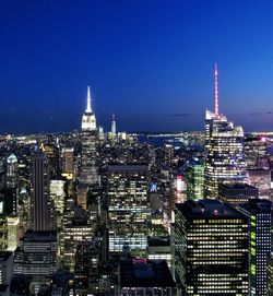 View of skyscrapers lit up at night