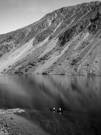 High angle view of swan on lake against mountain range